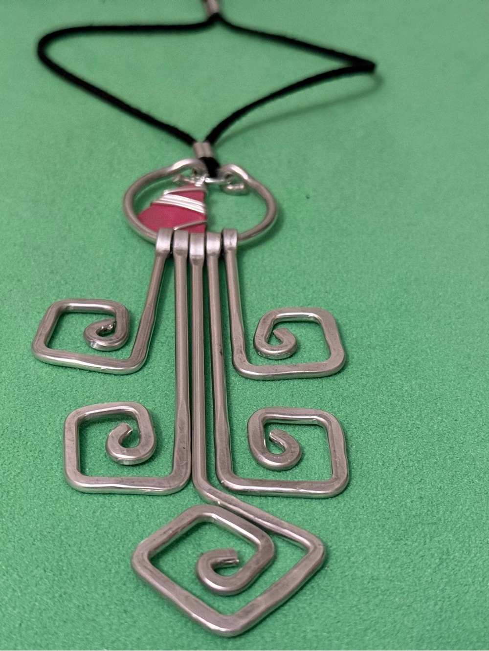 Handcrafted Silver-Tone Spiral Pendant Necklace with Pink Accent